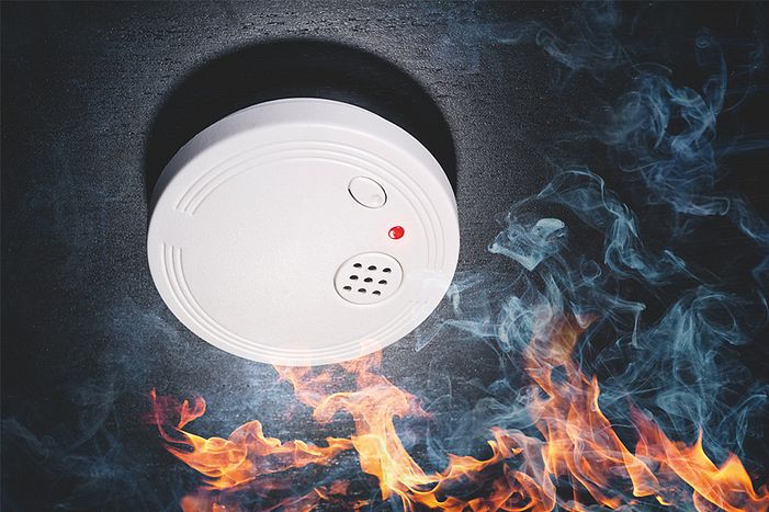 Fire and smoke cause a smoke detector to alarm.