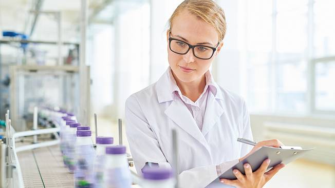 Food inspector checking dairies for food hygiene compliance