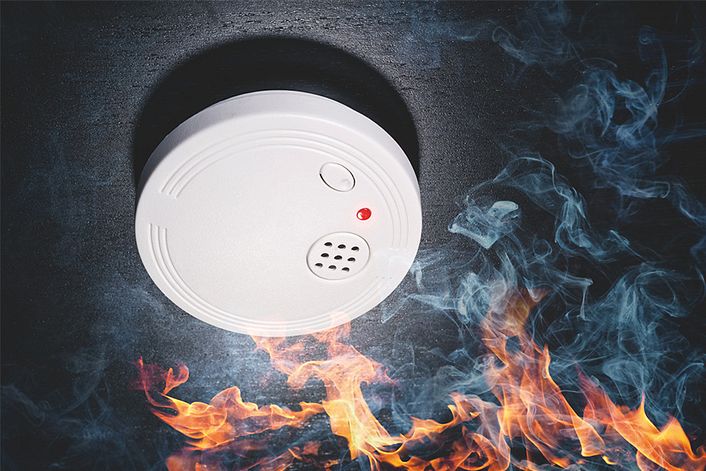 Fire and smoke cause a smoke detector to alarm.