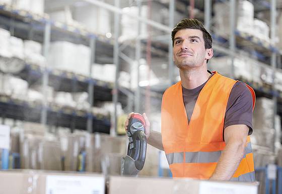 Logistican in a warehouse transporting goods