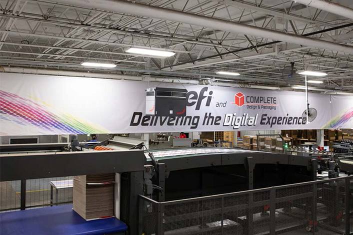 Industrial air purifier hanging in a large industrial hall.
