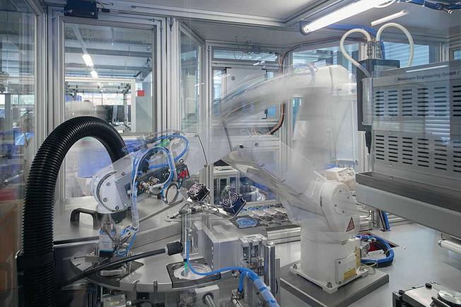 A robot fills bottles.