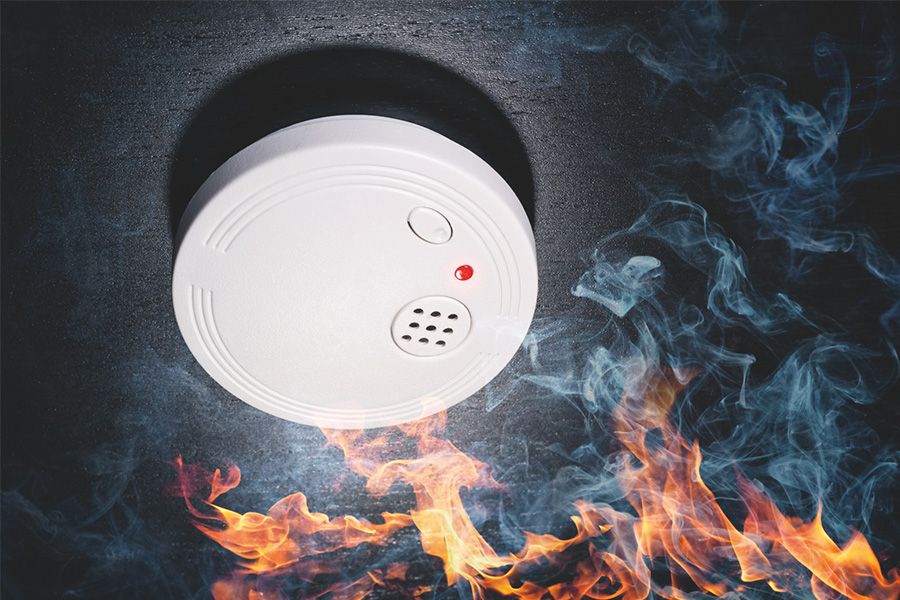 Fire and smoke cause a smoke detector to alarm.