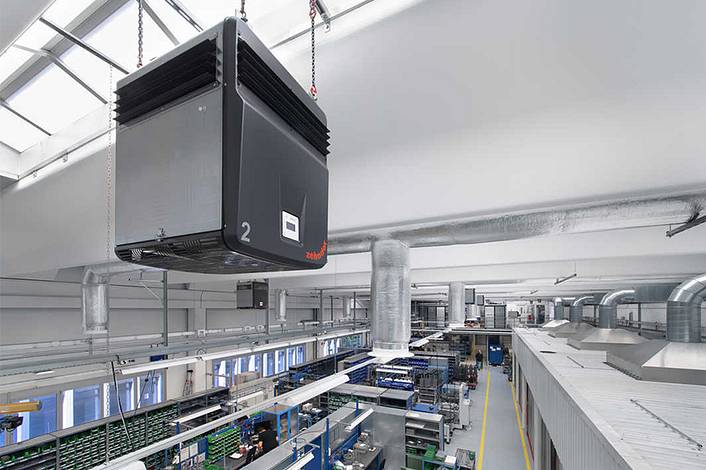 Factory building with industrial air cleaner.