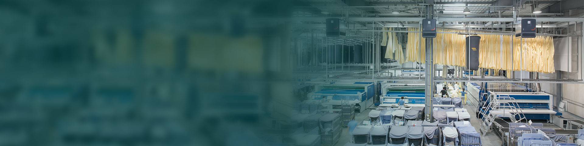 Large textile industry with industrial air purifiers on the ceiling