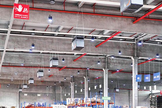 Air cleaning units hanging from ceiling at CHI Cargo Handling's site