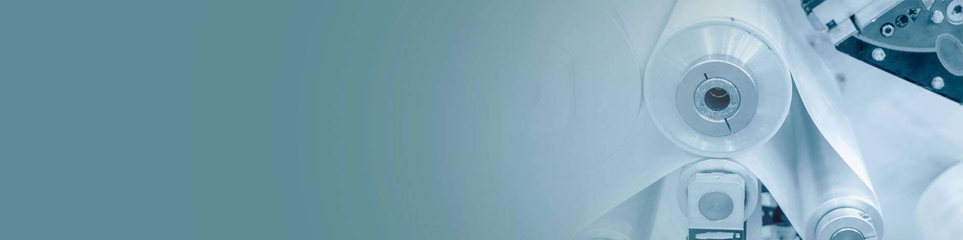 Plastic foil being transported via several rolls on a machine