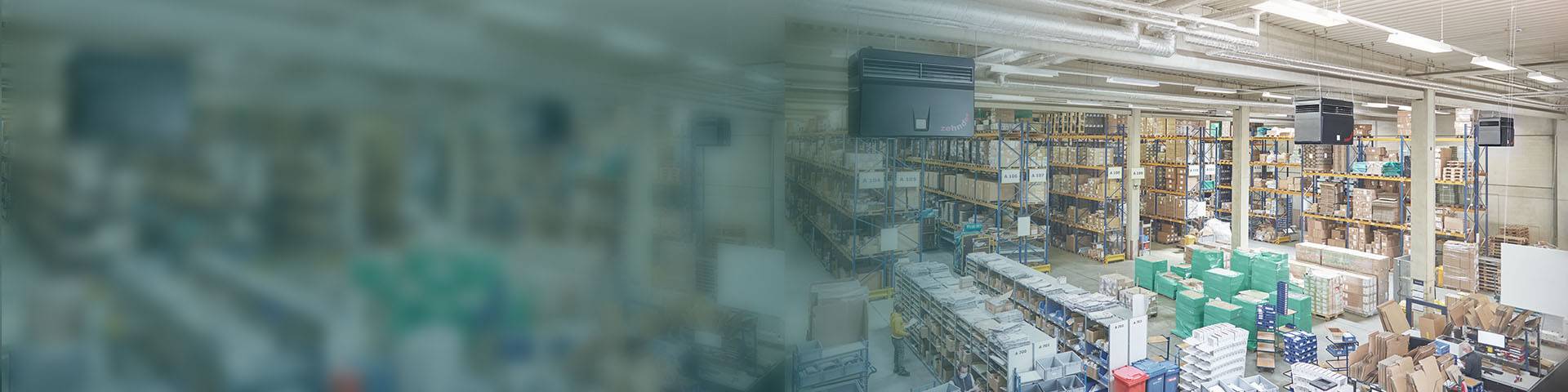 Industrial air purification systems are installed in a logistics hall with many high-bay warehouses.