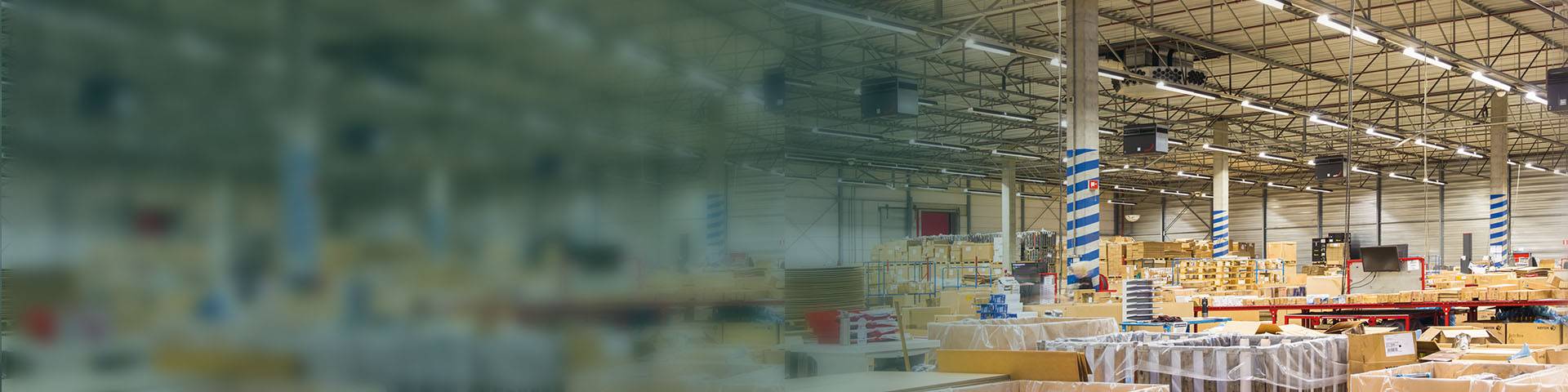 Large logistics hall with industrial air purifiers.