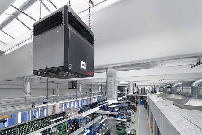 Factory building with industrial air cleaner.