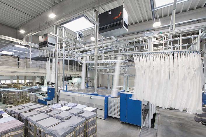 Large textile industry with industrial air purifiers on the ceiling