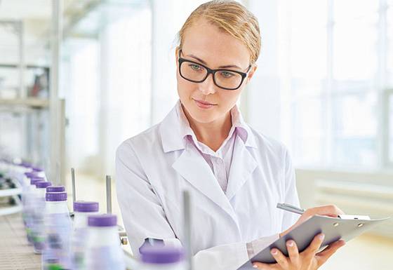 Food inspector checking dairies for food hygiene compliance