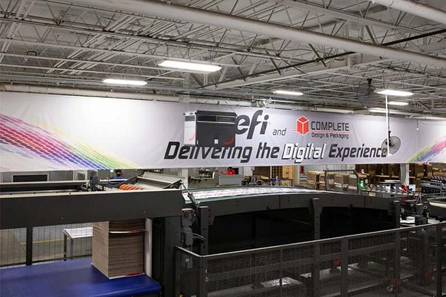 Industrial air purifier hanging in a large industrial hall.
